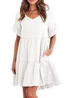 Lightweight rayon mini dress with ruffled sleeves, tiered design, and pockets, featuring a trendy, feminine silhouette.