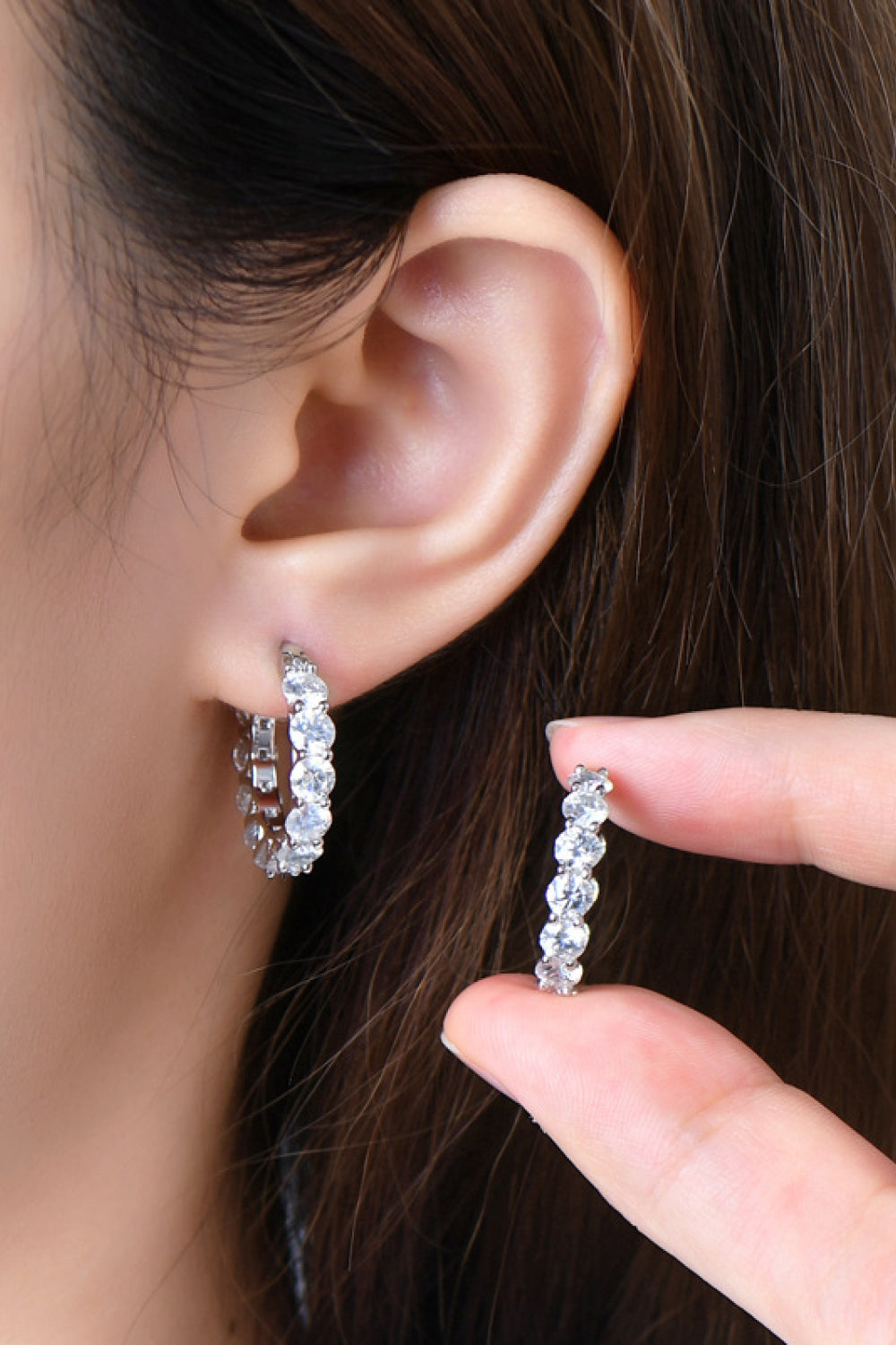 Sterling silver moissanite earrings with 7.2 carats, featuring sparkling gemstones and elegant design.