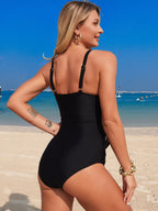 Women's solid color one-piece swimsuit with ruched design and tummy control, stylish swimwear by Trendsi.