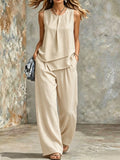 Women's sleeveless two-piece set by FitiqueFit featuring solid color wide-leg pants and matching sleeveless top.