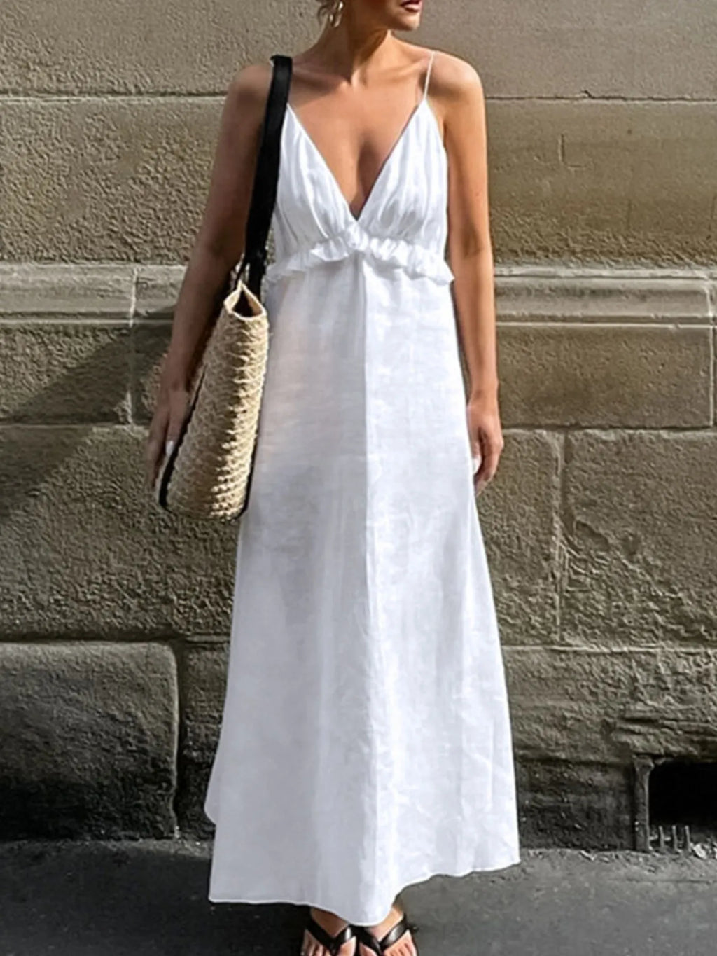 Women's ruffled V-neck cotton maxi dress by Trendsi, featuring a flowy boho style with a flattering V-neck and ruffled details.