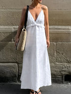 Women's ruffled V-neck cotton maxi dress by Trendsi, featuring a flowy boho style with a flattering V-neck and ruffled details.