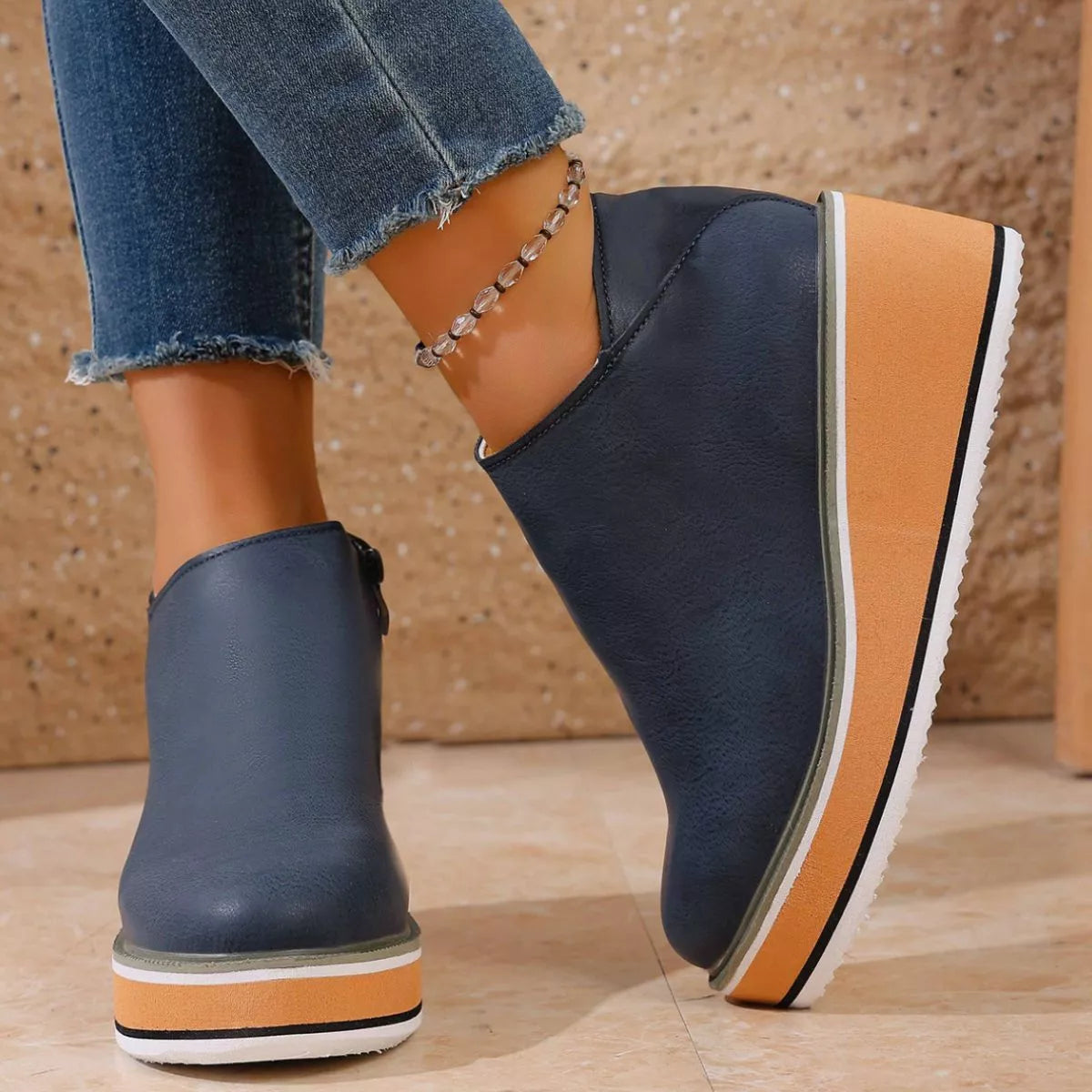 Women's Round Toe Wedge Ankle Boots by Trendsi featuring a stylish design and ankle-height silhouette.