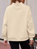 Women's oversized mock neck dropped shoulder pullover sweatshirt from Trendsi, casual and cozy top with relaxed fit.