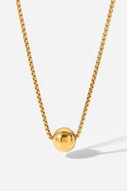 18K gold-plated round pendant necklace featuring a sleek, polished design with a delicate chain.