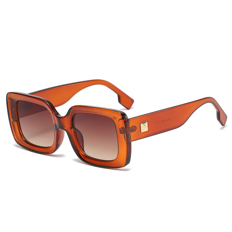 Large square retro sunglasses with bold black frames from Plush Fashion Hub, featuring classic style and UV protection.