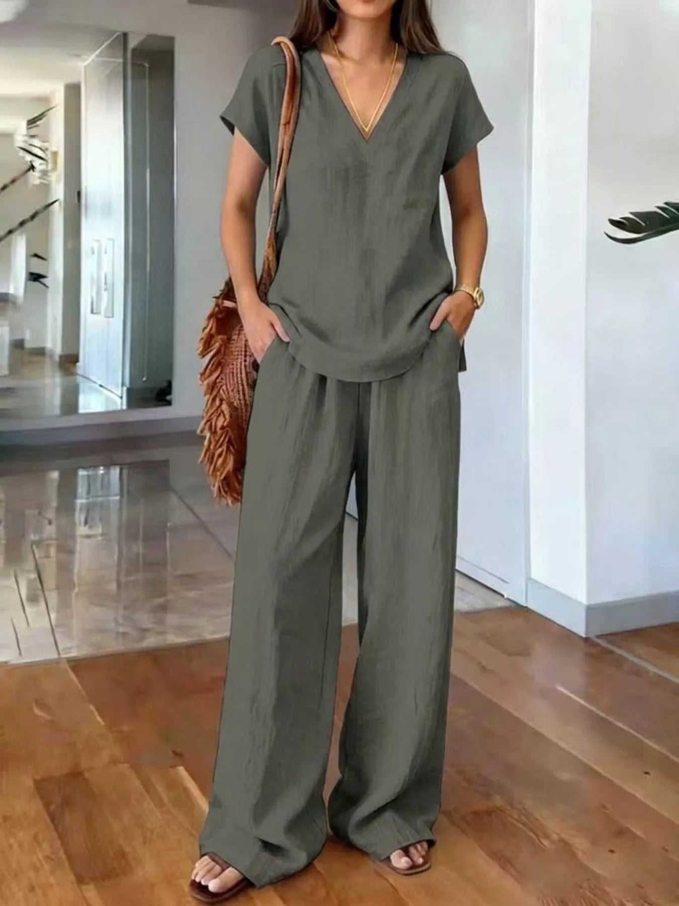 Plus size Trendsi loungewear set with a V-neck short sleeve top and matching pants, comfortable and stylish for relaxing wear.