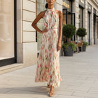 Women's halterneck high-waist swing dress by FitiqueFit featuring floral and solid print casualwear, flowing fabric and stylish design.