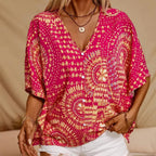 Mandala print V-neck blouse by Plush Fashion Hub, casual vacation top with relaxed fit and vibrant pattern, perfect for summer wear.