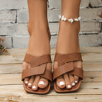 Plush Fashion Hub crisscross strap open toe flat sandals with stylish design and comfortable fit, perfect for casual wear.
