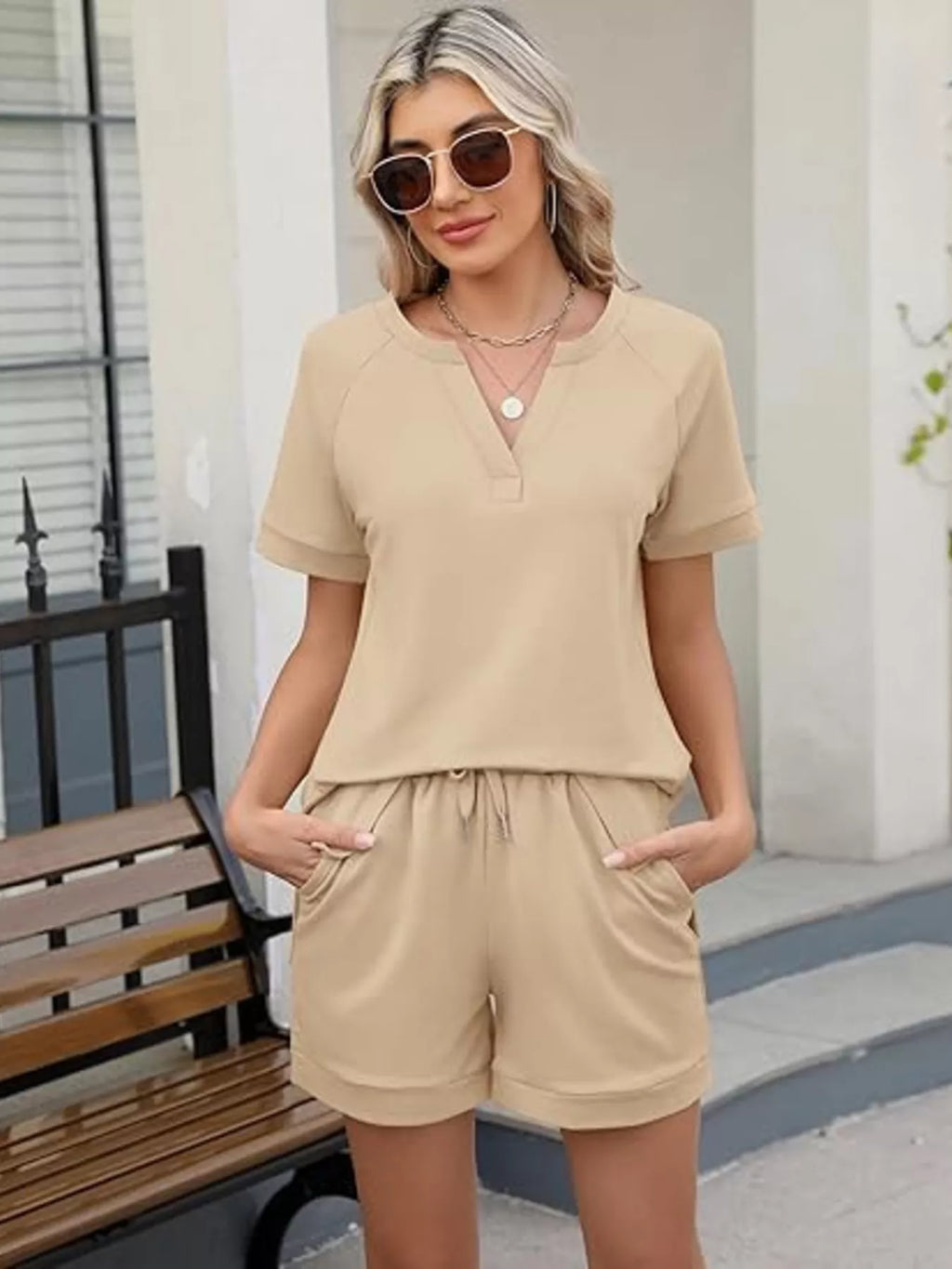 Solid color short sleeve top and shorts two-piece set by Trendsi, casual summer outfit, lightweight fabric, comfortable fit.