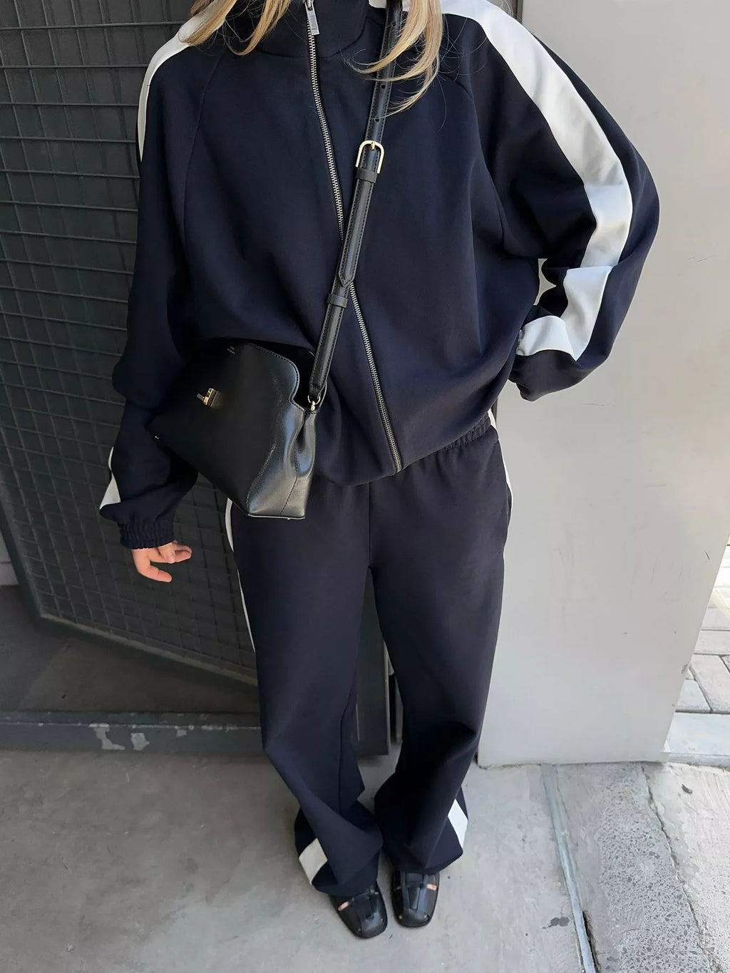 Trendsi zip-up long sleeve tracksuit set with matching pants, featuring a comfortable fit and casual style.