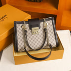 Genuine leather women's fashion bag with stylish design, featuring a structured shape and top handle in a classic color.