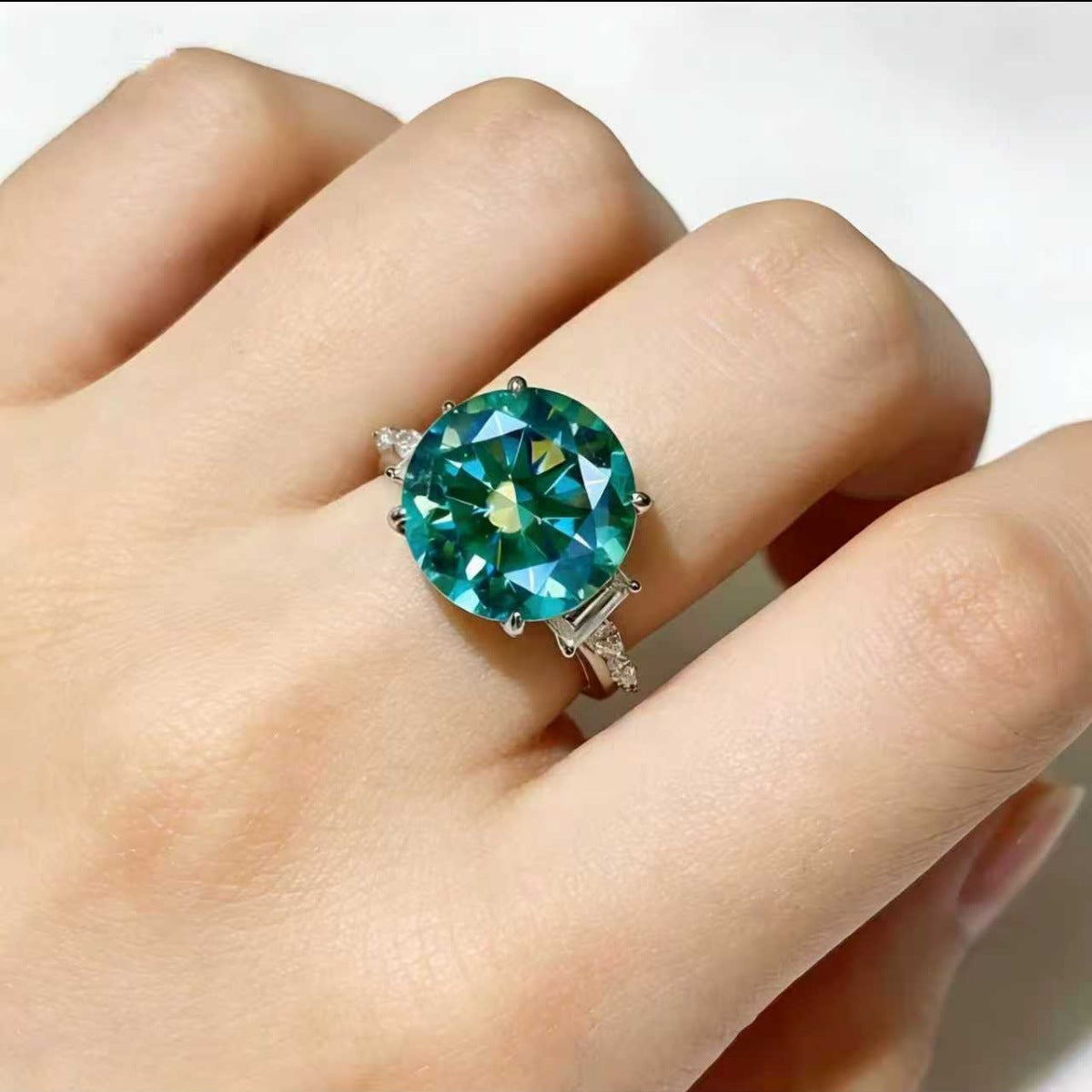 Elegant 8 carat moissanite sterling silver ring with a sparkling gemstone, crafted by Shopimist.
