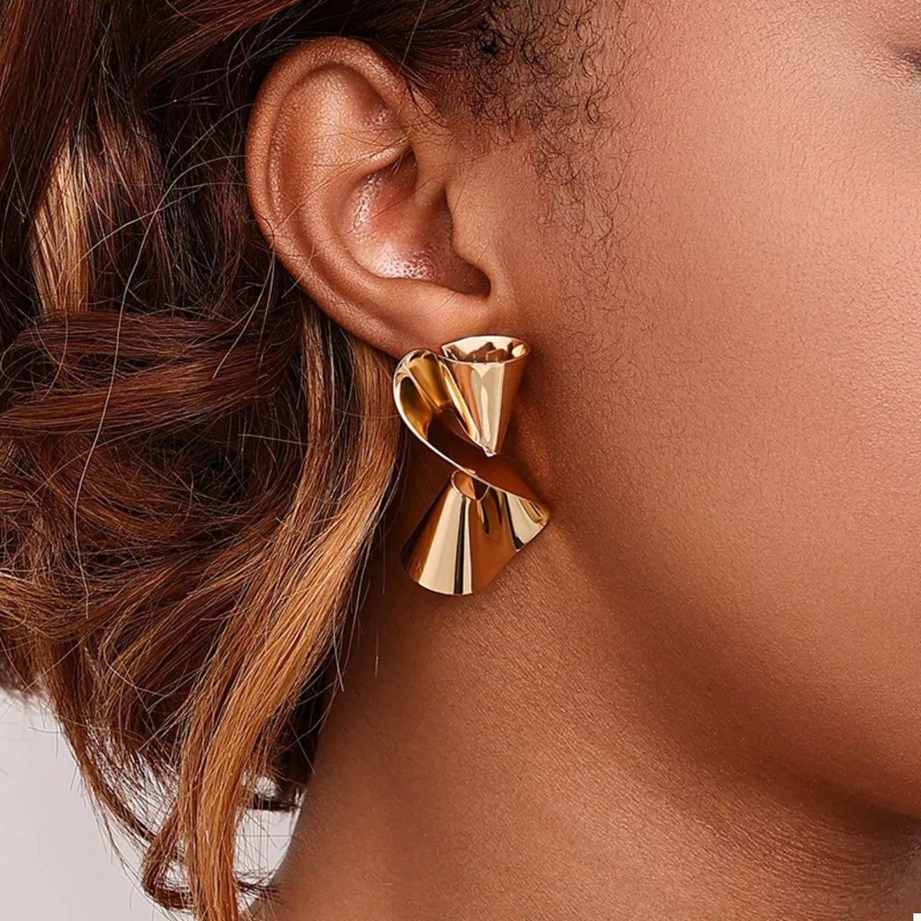 18K gold-plated twist earrings with sleek, modern design and shiny finish, perfect for elegant everyday wear by Shopimist