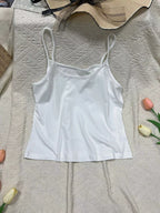 Solid color scoop neck cami tank top by Plush Fashion Hub, featuring a simple, sleek design with adjustable straps.