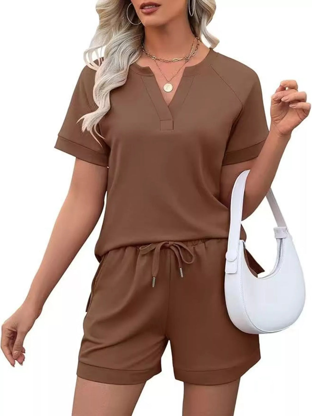 Solid color short sleeve top and shorts two-piece set from Trendsi, casual and comfortable summer outfit for women.