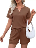 Solid color short sleeve top and shorts two-piece set from Trendsi, casual and comfortable summer outfit for women.