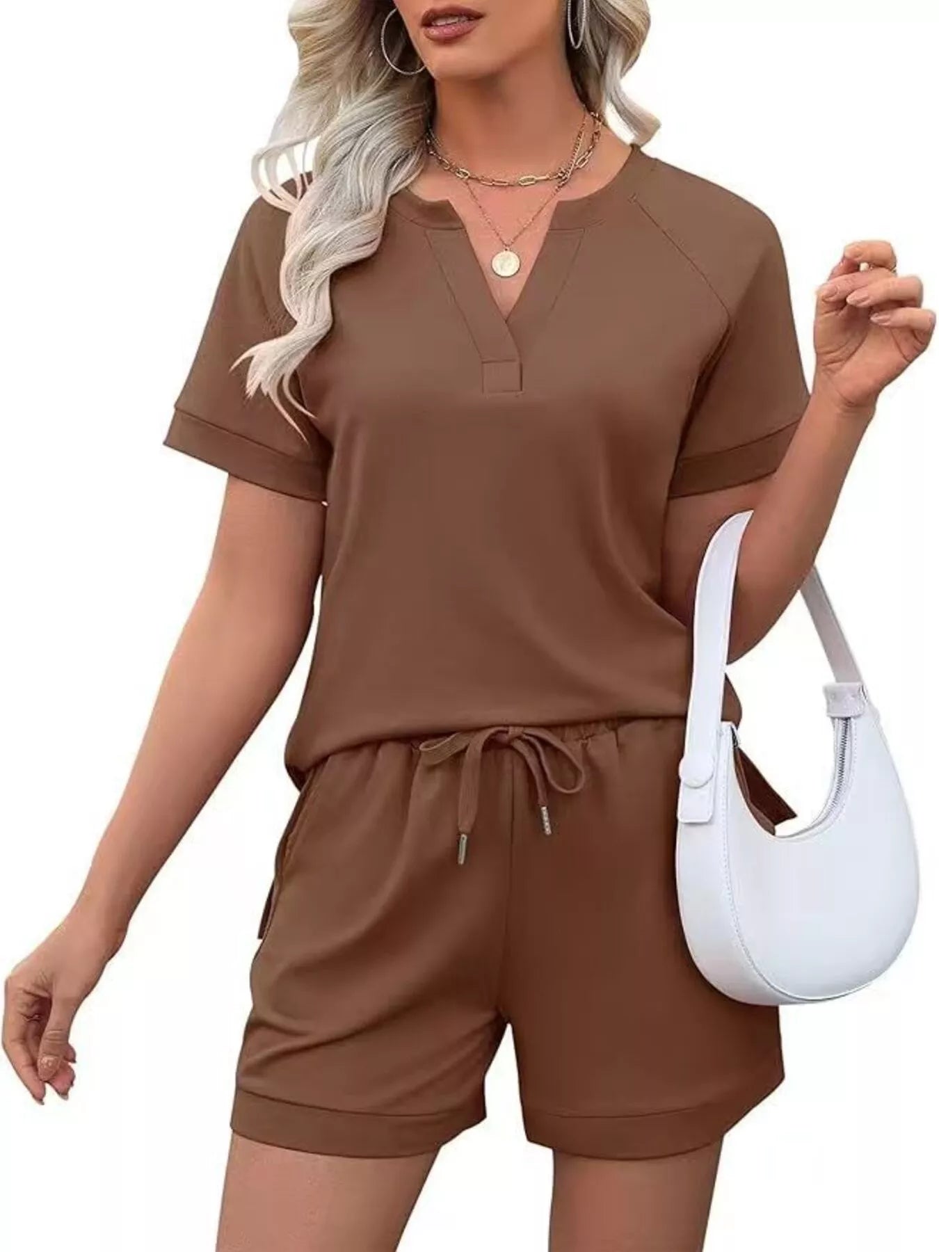 Solid color short sleeve top and shorts two-piece set from Trendsi, casual and comfortable summer outfit for women.