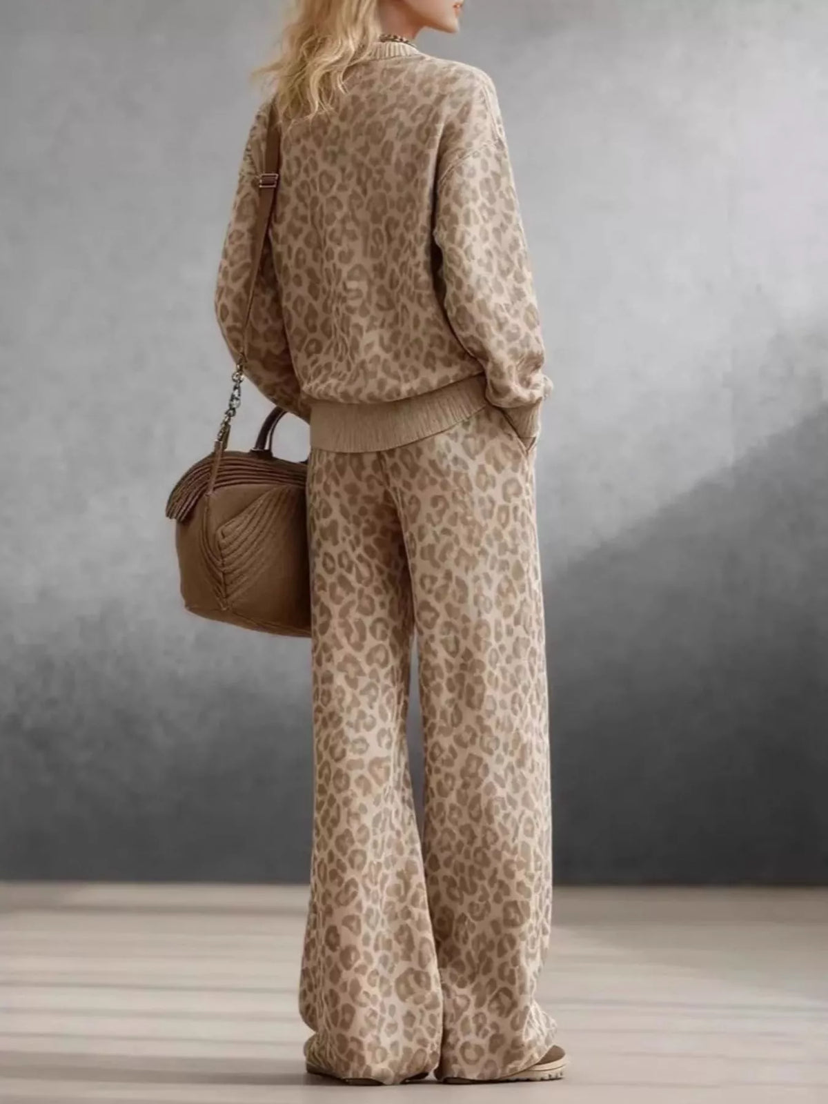 Leopard print dropped shoulder top and matching pants set by Trendsi, stylish and comfortable for casual wear.