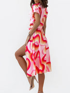 Printed button front midi dress with belt from Shopimist featuring a stylish, flowy design and waist-cinching belt detail.