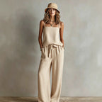 Women's casual two-piece set by FitiqueFit featuring a spaghetti strap cami top and wide-leg pants in soft fabric.