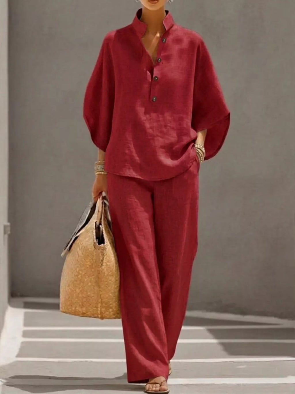 Women's plus size two-piece dress set with button-detail 3/4 sleeves and matching pants from Trendsi, shown in black.