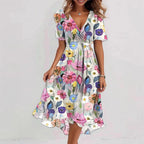 Floral print V-neck A-line dress with short sleeves, midi length, by FitiqueFit, displayed on a mannequin.