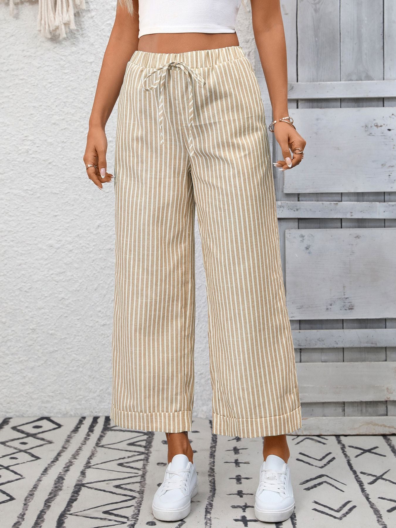 Women's striped wide-leg drawstring pants with pockets by Trendsi, featuring a relaxed fit and comfortable waistband.