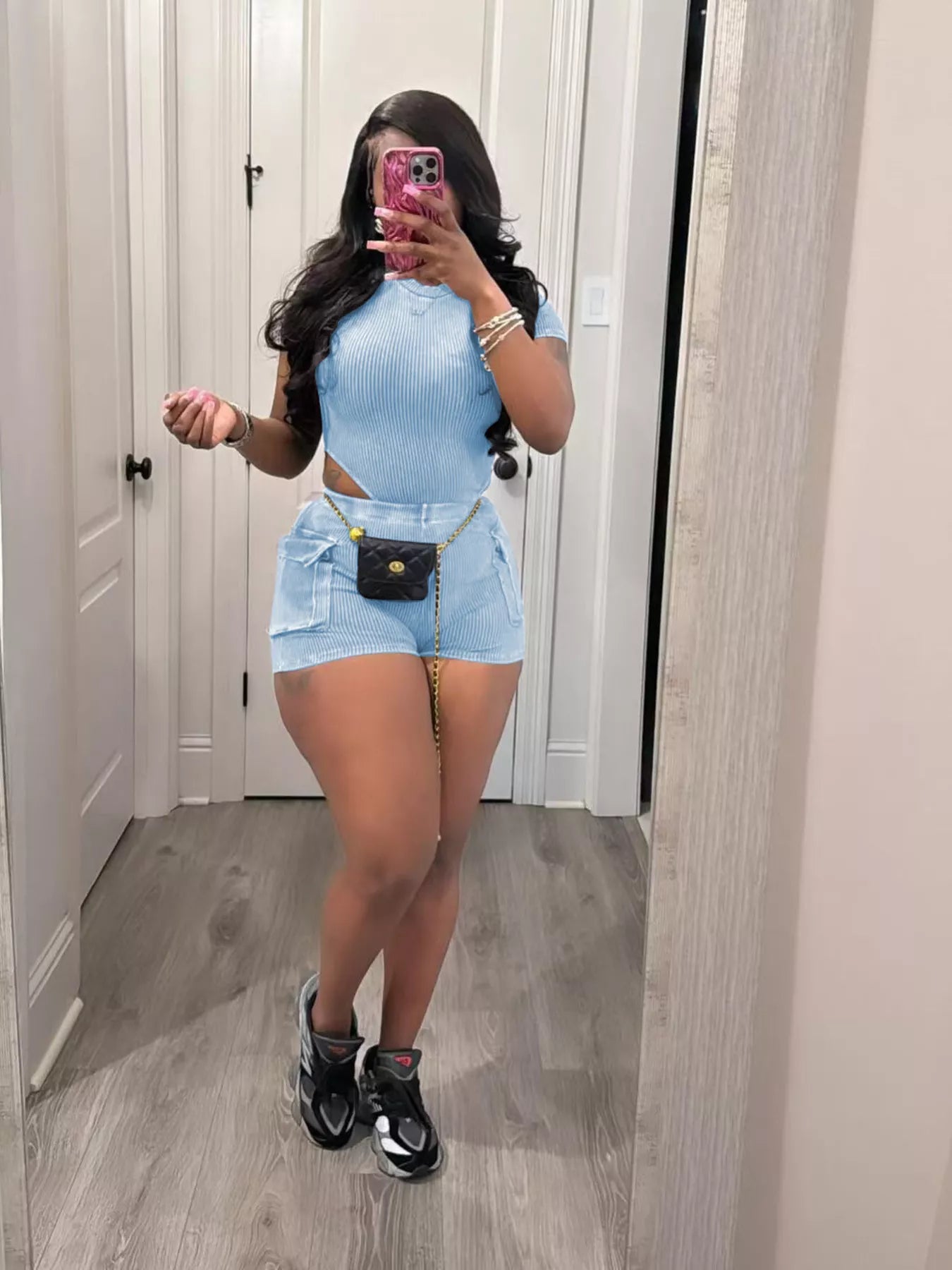 Ribbed knit bodysuit and shorts set by Plush Fashion Hub, featuring a fitted two-piece outfit in soft, textured fabric.