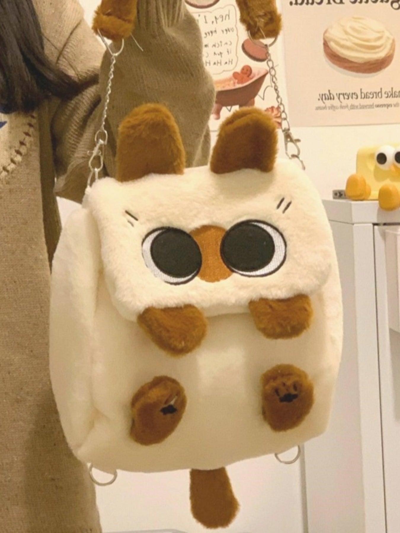 Soft woolen plush cat mini backpack from Trendsi featuring a whimsical design, perfect for casual wear and cute style.