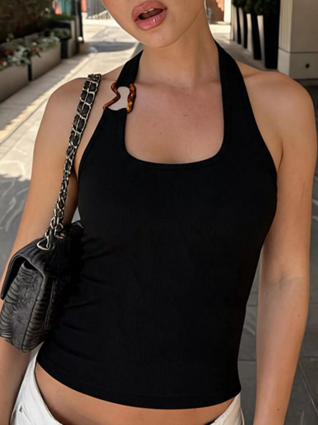 Ribbed halter neck tank top by Shopimist, featuring a fitted design and sleeveless style, shown in a neutral color.