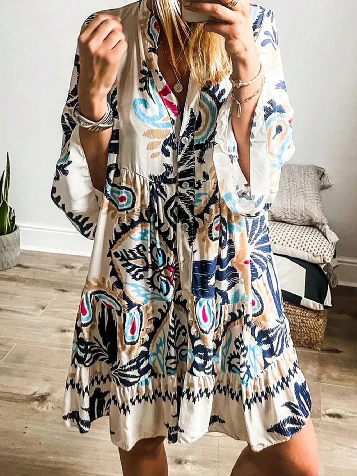 Bohemian print tiered mini dress by Plush Fashion Hub featuring flowy fabric and colorful boho-inspired patterns.