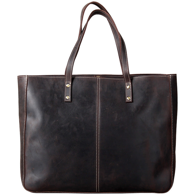 Simple retro men's large-capacity handbag made of cowhide leather, featuring a classic design and ample storage space.