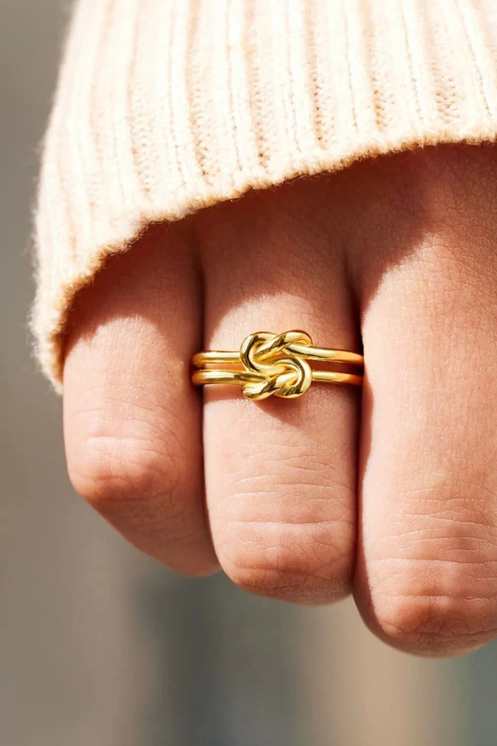 925 sterling silver knotted ring with a polished finish, showcasing a stylish and elegant design.