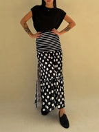Flowy women's polka dot and striped maxi skirt with a slit, casual bohemian style, by Trendsi.