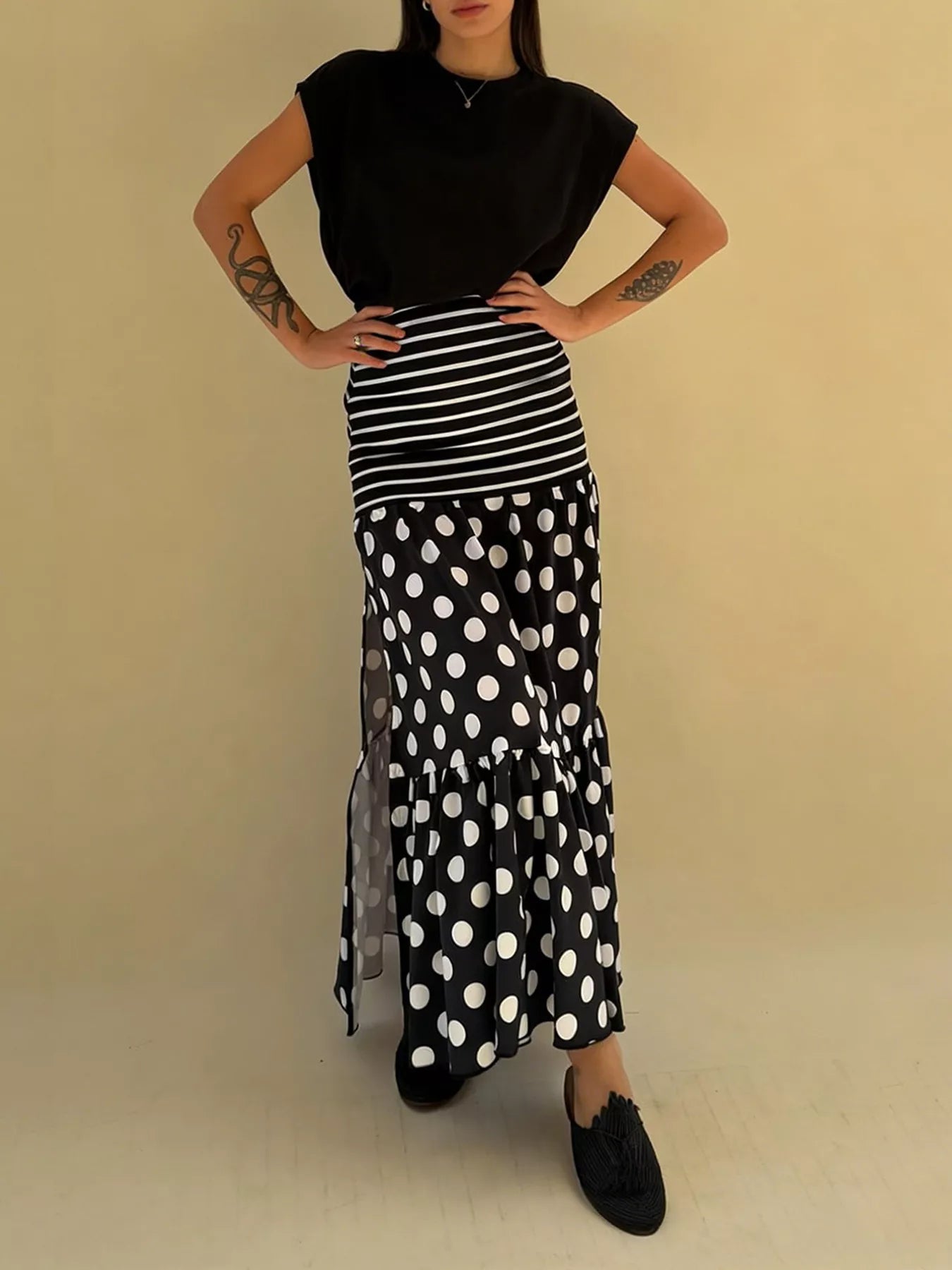 Flowy women's polka dot and striped maxi skirt with a slit, casual bohemian style, by Trendsi.