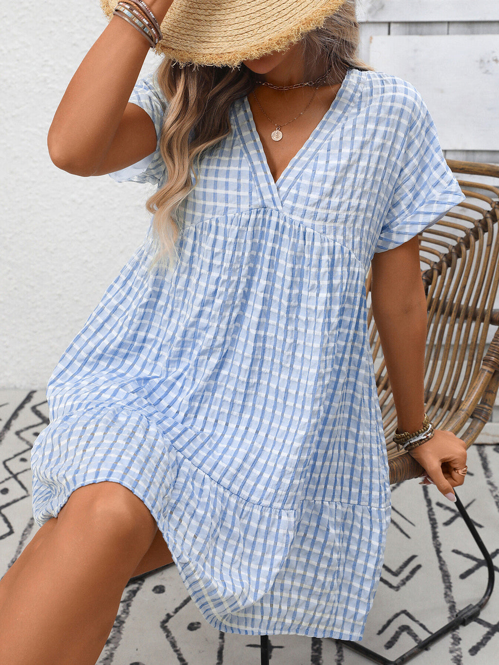 Plush Fashion Hub's chic plaid V-neck mini dress with ruffle hem, lightweight and perfect for seasonal fashion.