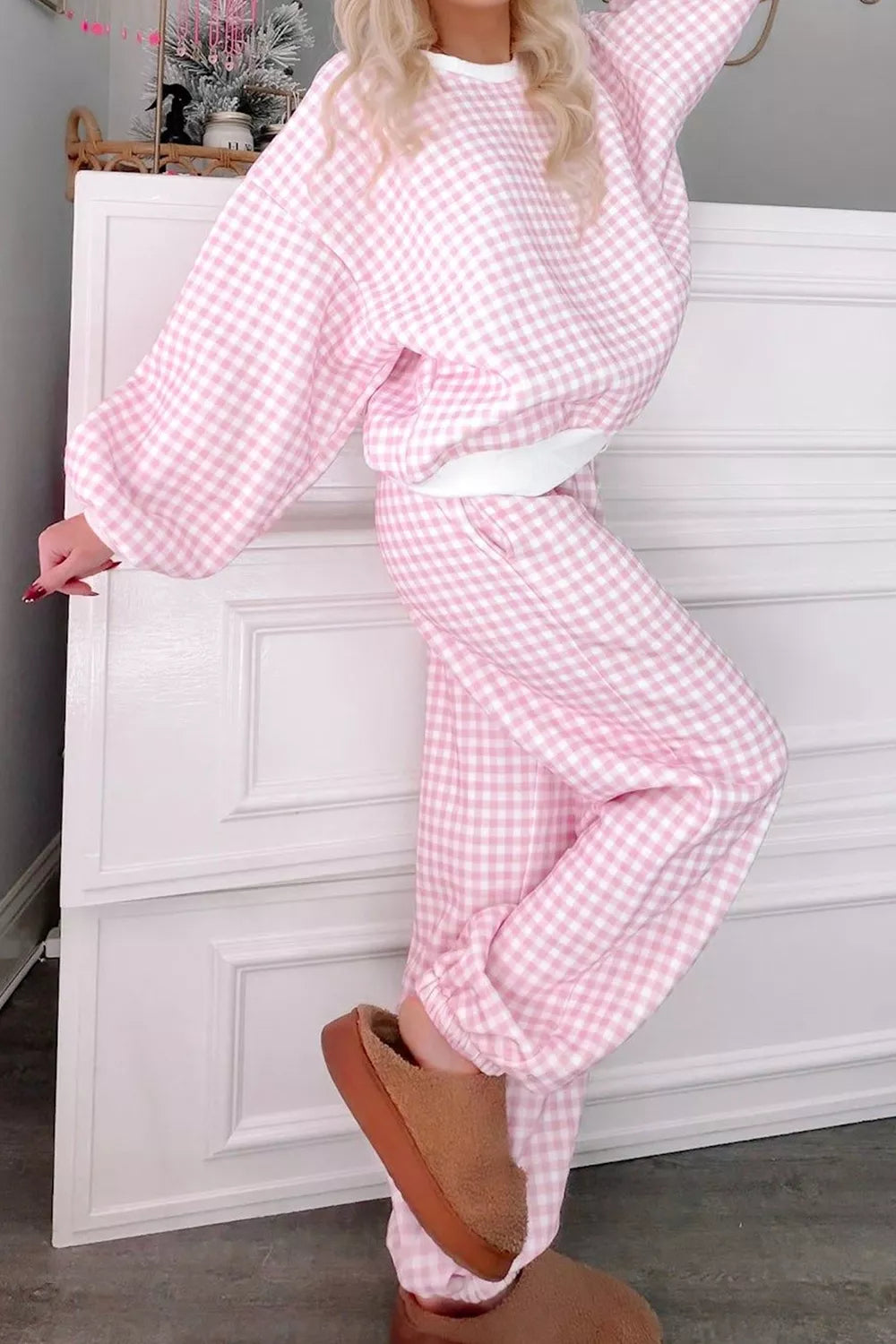 Women’s gingham round neck top and pants set by Trendsi, featuring a stylish matching pattern and comfortable fit.
