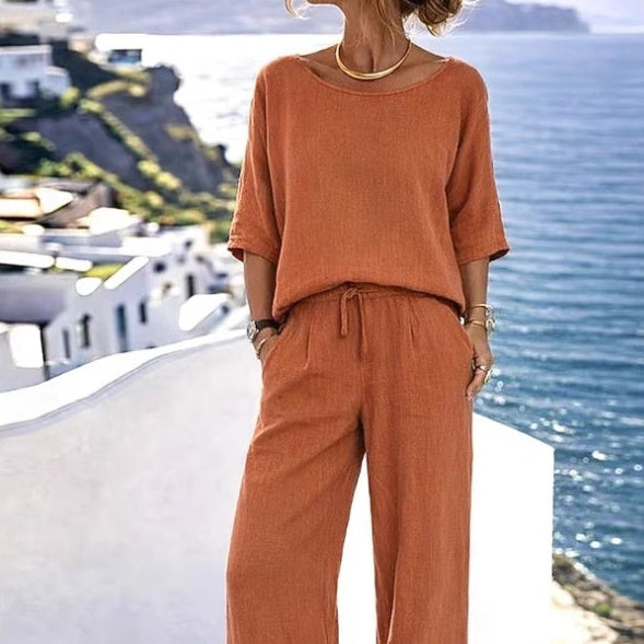Women's resort set by FitiqueFit featuring a short sleeve top and wide-leg pants, perfect for casual summer wear.