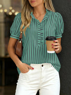 Women's striped puff sleeve blouse with ruffled details, stylish and feminine fashion top by Trendsi.