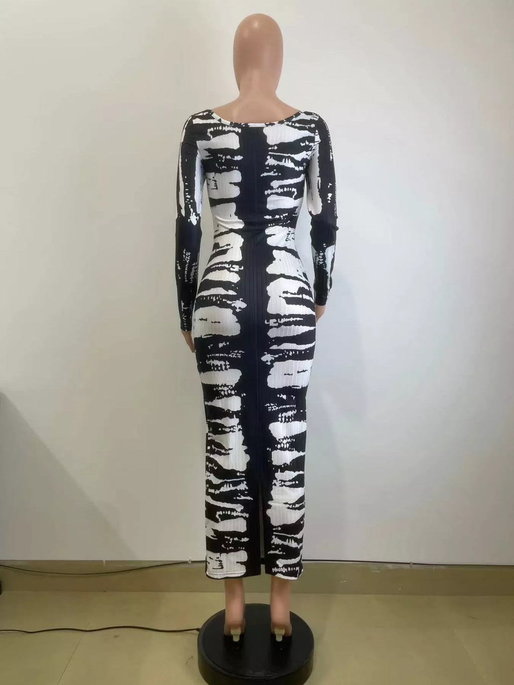 Colorful tie-dye long sleeve maxi dress by Shopimist featuring a flowing design and vibrant patterns.