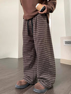 Men's plaid wide leg casual pants with drawstring waist by Trendsi, featuring a relaxed fit and stylish plaid pattern.