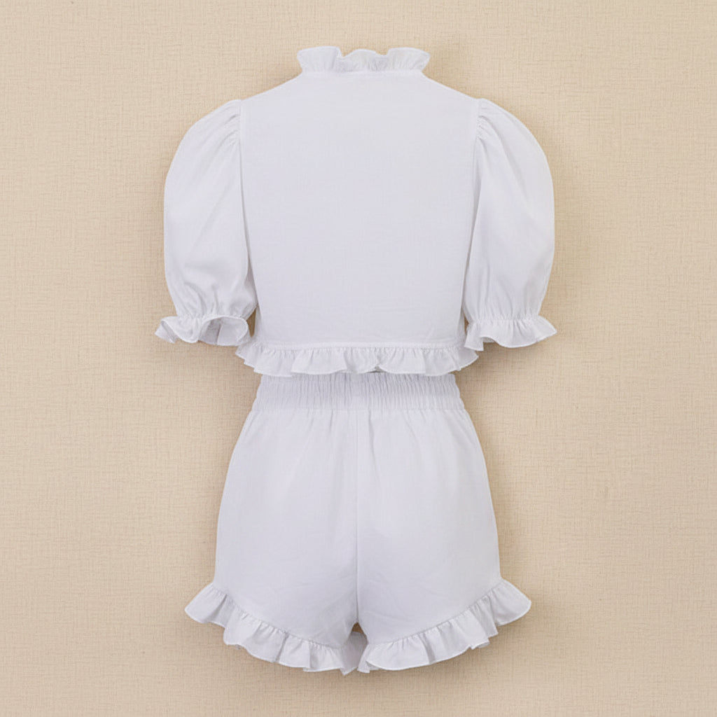 Women's ruffled linen-blend cropped blouse and shorts set by FitiqueFit, featuring lightweight fabric and stylish ruffle details.