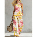 Printed retro sleeveless top and wide-leg pants two-piece set by Plush Fashion Hub featuring vibrant print designs and relaxed fit.