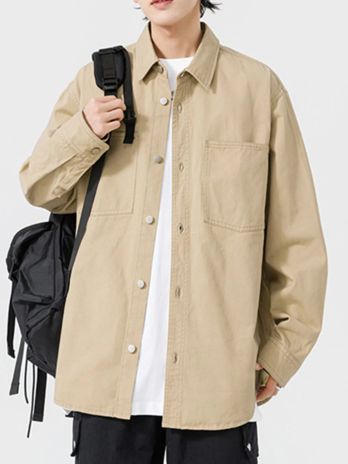 Men's long sleeve button-up shirt by Trendsi, shown in a classic design with collar and button front, styled for casual or formal wear.