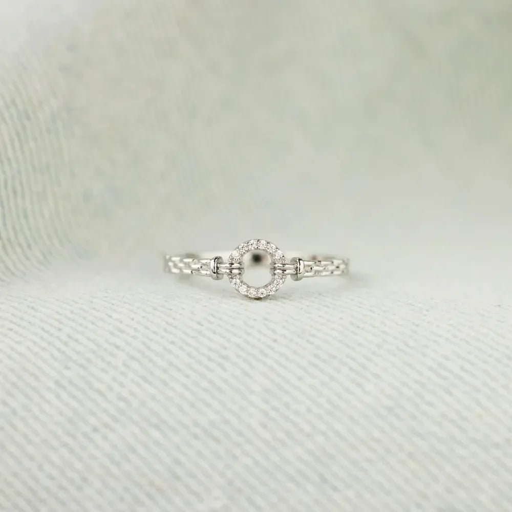 Sterling silver ring with inlaid zircon stones from Shopimist, showcasing a detailed design and sparkling gemstone accents.