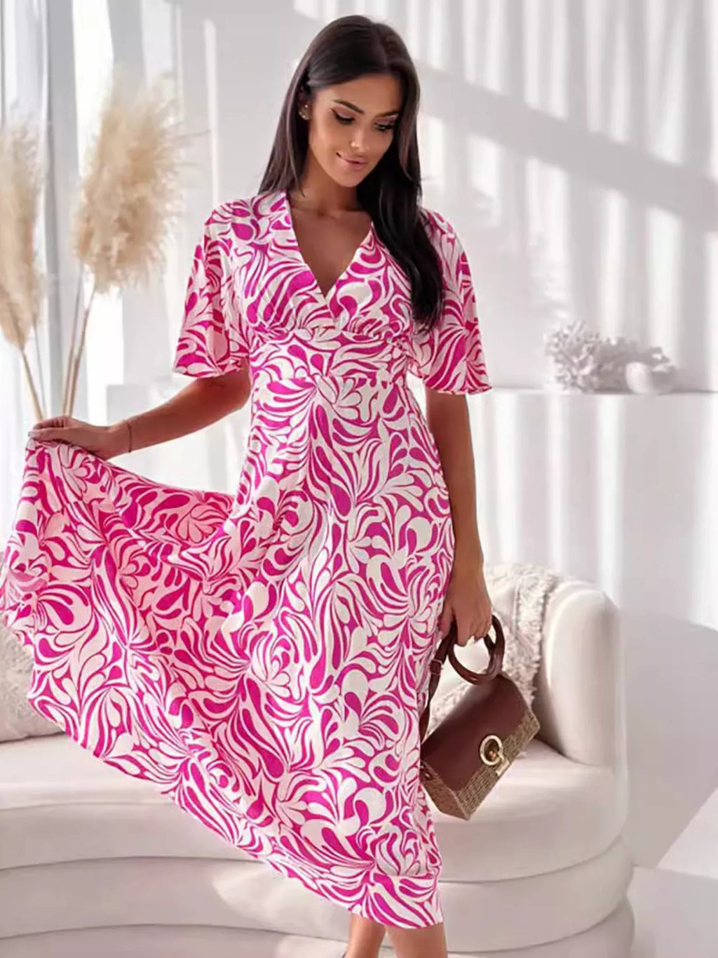 Printed flutter sleeve midi dress by Shopimist featuring a flowy design and vibrant pattern, perfect for casual or semi-formal occasions.