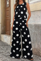 Polka dot sleeveless top and wide-leg pants two-piece set from Trendsi, featuring a stylish sleeveless blouse and flowy pants.