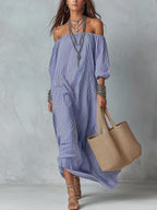 Women's striped loose-fit flared maxi dress by FitiqueFit, featuring a flowy silhouette and bold stripe pattern, perfect for vacation.